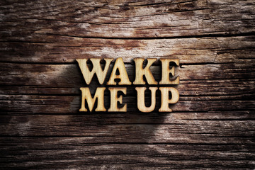 Fototapeta premium Wake me up. Words on old wooden board.