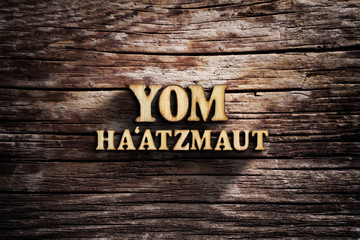Fototapeta premium Yom Ha'atzmaut. Words on old wooden board.