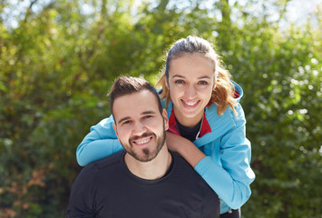 Young running couple jogging in autumn nature