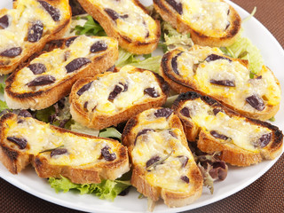 Bruschetta with olives and mozzarella
