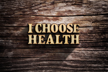 I choose Health. Words on old wooden board.