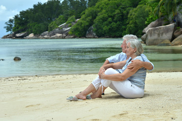 elderly couple rest at tropical resort