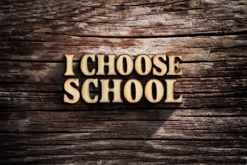 I choose School. Words on old wooden board.