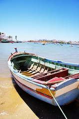 Fototapeta na wymiar boat in the bay Ferragudo, Portugal.