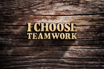 I choose Teamwork. Words on old wooden board.