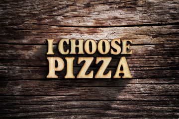 I choose Pizza. Words on old wooden board.