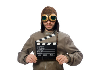 Pilot holding movie clapboard on white