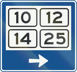 Dutch signpost within a built-up area showing district numbers