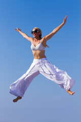 Young Woman in Blue bikini at the beach