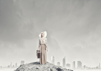 Woman with old suitcase