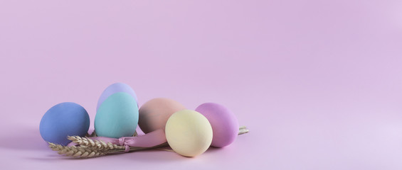 Colorful Easter eggs composition with sheaf of wheat letterbox