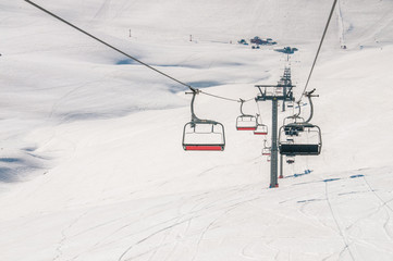 Ski lifts durings bright winter day