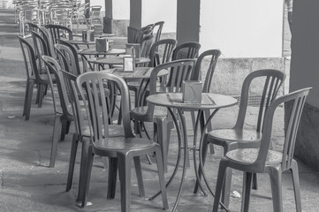 Empty bar, bistro or cafe terrace with plastic and metal chairs
