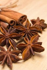 Cinnamon sticks and anise on wooden table, seasoning for cooking