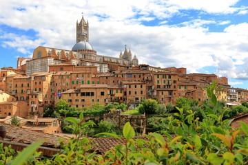 Fototapeta na wymiar View of Siena towards Siena Cathedral in Italy