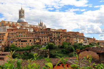 Fototapeta na wymiar View of Siena towards Siena Cathedral in Italy