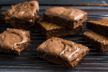 Homemade chocolate brownies on dark background