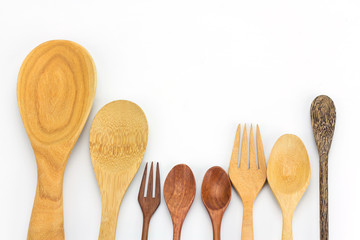 Assorted wooden tableware on white background