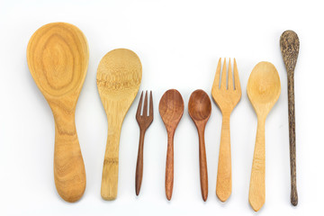 Assorted wooden tableware on white background
