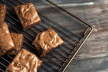 Homemade chocolate brownies on dark background