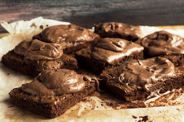 Homemade chocolate brownies on dark background