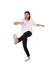 Young man kicking isolated on white