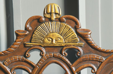 Ben Franklin's early American hand carved chair with rising sun design