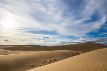 Fototapeta na wymiar Landscape of White sand dune desert with blue sky cloud at Mui n