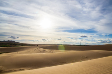 Obraz na płótnie Canvas Landscape of White sand dune desert with blue sky cloud at Mui n