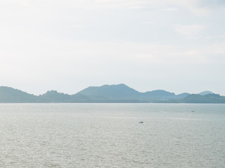 Sailboat on the sea with mountain background taken by rule of th