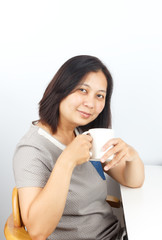 asian woman who takes a drink
