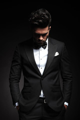 Fototapeta premium elegant young business man looking down