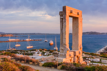 the Ancient marble gate "Portara" - the entrance to the temple of Apollo, Naxos island, Cyclades, Greece.