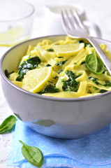 Homemade egg noodle with spinach.