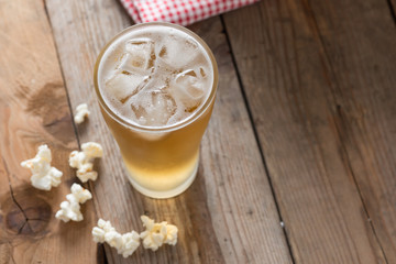 Glass beer on wood table. Selective focus.