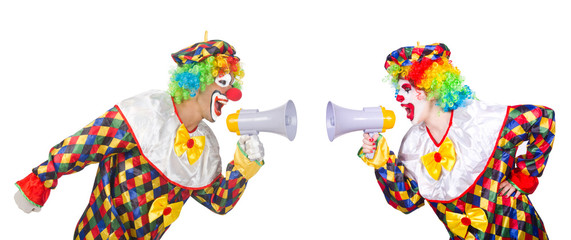 Two clowns with loudspeakers isolated on white