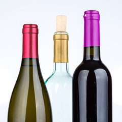 Three wine bottles isolated on white background