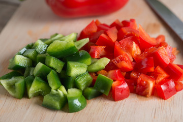 Close up. Chopped green bell pepper and red bell pepper.