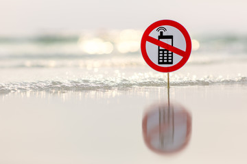 "No phone calls" sign on the beach on sea background