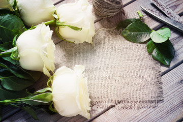 White Roses on the Wooden Table