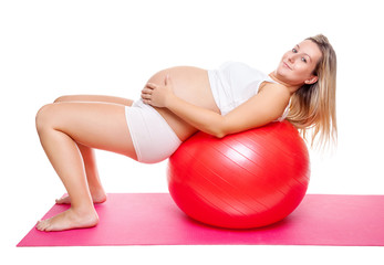 Fototapeta premium Workout with fitness ball during pregnancy
