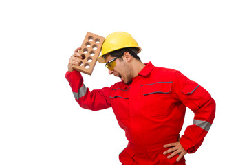 Construction worker with clay bricks on white