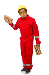 Construction worker with clay bricks on white
