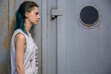 Blue haired hirl walk on Old rusty forsaken barges