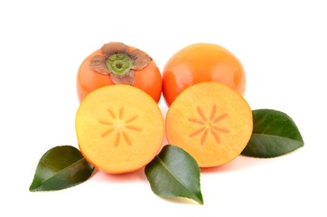 Kaki fruit with leaves. 