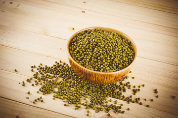 red  beans on wood background - soft focus with vintage film fil