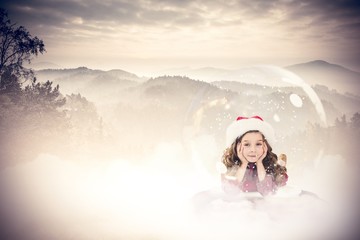 Fototapeta na wymiar Composite image of festive child in snow globe