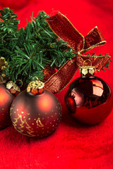 Red christmas balls on red background