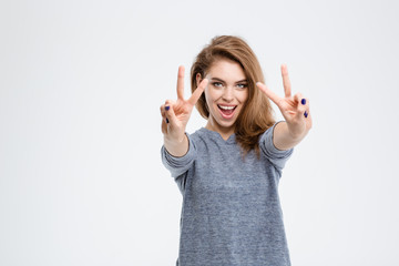 Cheerful woman showing two fingers sign