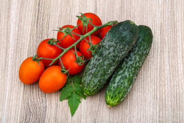 Cucumbers and tomatoes on the branch